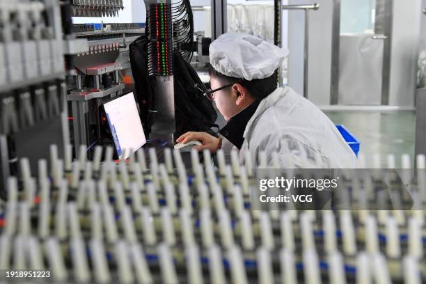 An employee conducts a test at a medical devices production workshop on January 9, 2024 in Shangqiu, Henan Province of China.