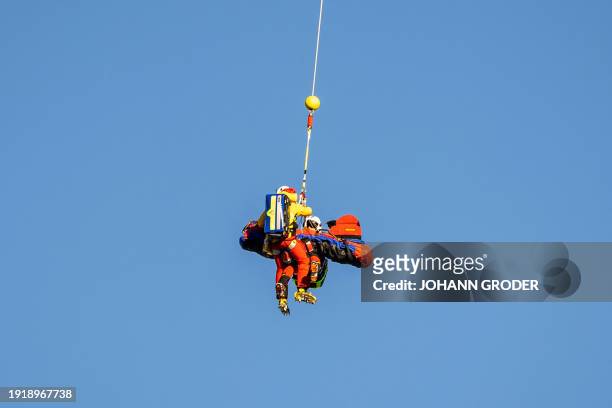 Austria's Nadine Fest and medics are transported by a rescue helicopter after her fall during women's Super-G event of the FIS Ski Alpine World Cup...