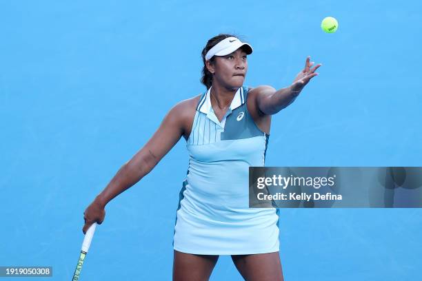 Destanee Aiava of Australia serves in their match against Chloe Paquet of France ahead of the 2024 Australian Open at Melbourne Park on January 09,...