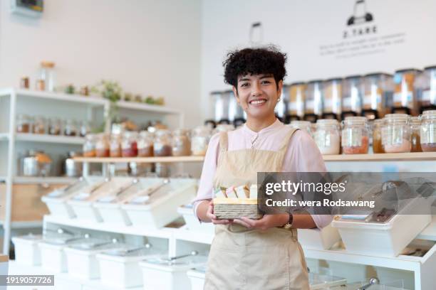 zero waste grocery business owner in confidence smile while standing in the  store - store opening stock-fotos und bilder