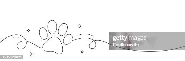 continuous line drawing of paw print icon. hand drawn symbol vector illustration. - paw stock illustrations