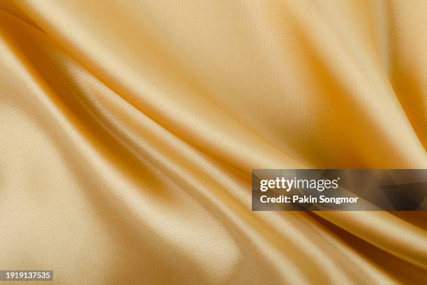 yellow color fabric cloth polyester texture and textile background. - cotton stock pictures, royalty-free photos & images