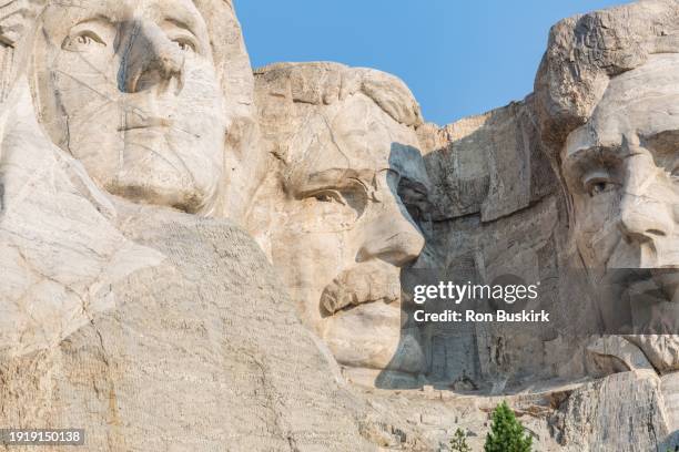 close up of the carved granite bust of theodore "teddy" roosevelt at mount rushmore national monument near keystone, south dakota - mt rushmore national monument imagens e fotografias de stock