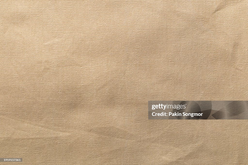 Brown canvas fabric cloth polyester texture and textile background.