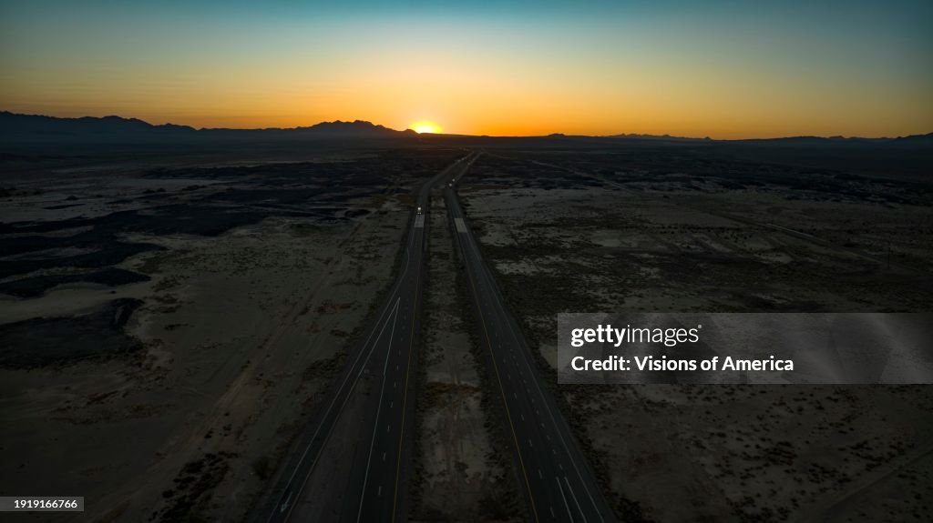 Sunrise over Interstate 40 as seen from air in desert in Southern California