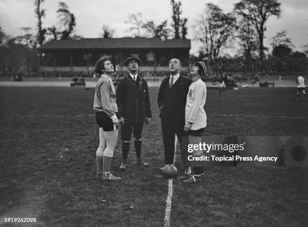 The captains of the French and English football teams, Carmen Pomies and Florrie Redford, with English comedian, singer and actor George Robey and...