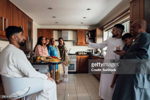 capturing moments on eid - orthographic symbol stock pictures, royalty-free photos & images