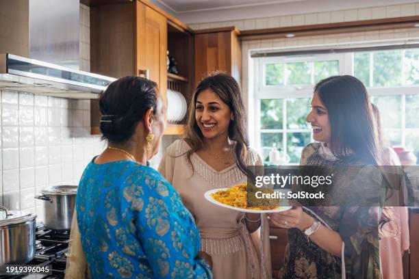 a festive family fusion - eid ul fitr stock pictures, royalty-free photos & images