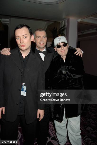 English singer Boy George with English musicians Neil Tennant and Chris Lowe at an AIDS charity gala at the Park Lane Hotel in London, January 1998.