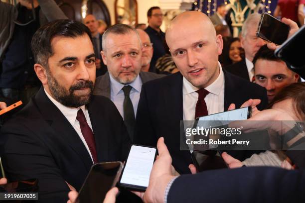 Humza Yousaf, Scottish First Minister and leader of the SNP and Stephen Flynn, MP for Aberdeen South speak to the media during the launch of the SNP...