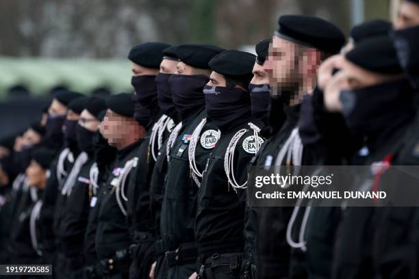 Members of the French National Police elite unit RAID stand during the inauguration ceremony of their new chief in Bievres, outside Paris, on January...