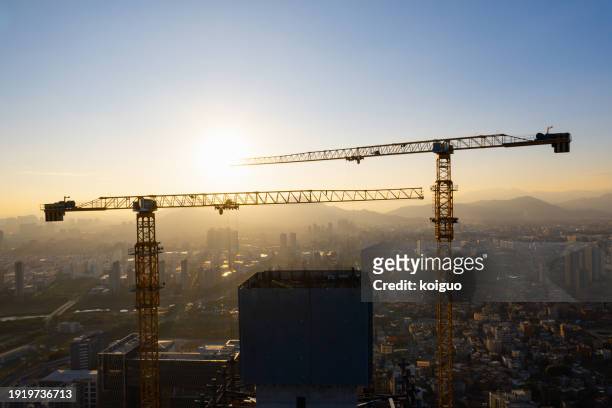 skyscrapers and cranes under construction - xiamen stock pictures, royalty-free photos & images