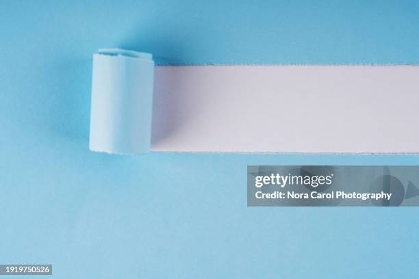 blue torn paper - curled up stock pictures, royalty-free photos & images