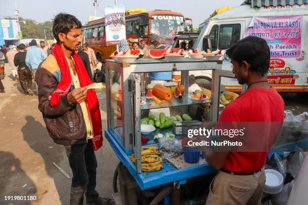 Fruit salad seller is seen at a fairground in Kolkata, India, on January 12, 2024.