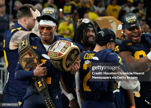 Michigan Wolverines defensive back Will Johnson, left, is seen after defeating Washington 34-13 during the national championship NCAA College...