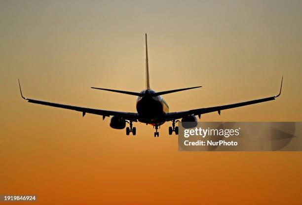 Ryanair aircraft is landing at night at Barcelona El Prat Airport in Barcelona, Spain, on January 8, 2024.