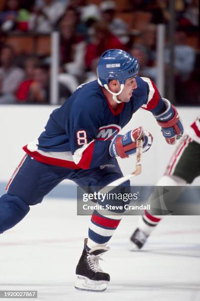 New York Islander's defenseman, Jeff Norton, races out of his zone to follow the play into the Devil's zone during the game against the NJ Devils at...