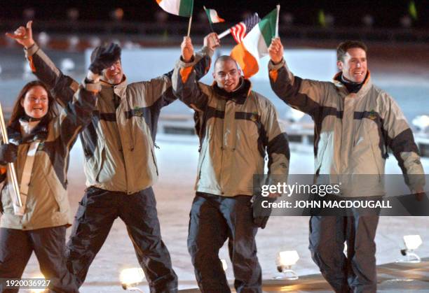 Ireland's athletes wave as they arrive with their delegation for the opening ceremonies of the 2002 Winter Olympics at the Rice Eccles Stadium 08...