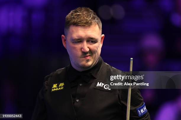 Kyren Wilson of England reacts during his first round match against Judd Trump of England during day three of the MrQ Masters Snooker 2024 at...