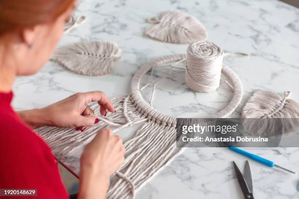 woman weaves macrame. close up - macrame stock pictures, royalty-free photos & images