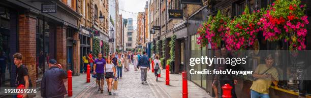 london people walking busy pedestrianised shopping street covent garden panorama - no choice stock pictures, royalty-free photos & images