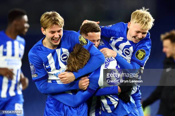 Harry Howell of Brighton and Hove Albion U21 celebrates with team mates after scoring in the penalty shoot out to win the Bristol Street Motors...