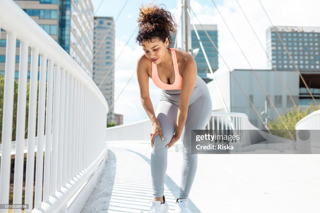A woman with a hurt knee