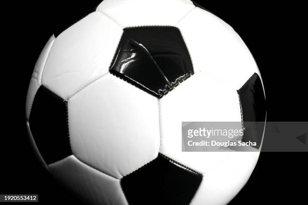 soccer ball on a black background - european championship stock pictures, royalty-free photos & images
