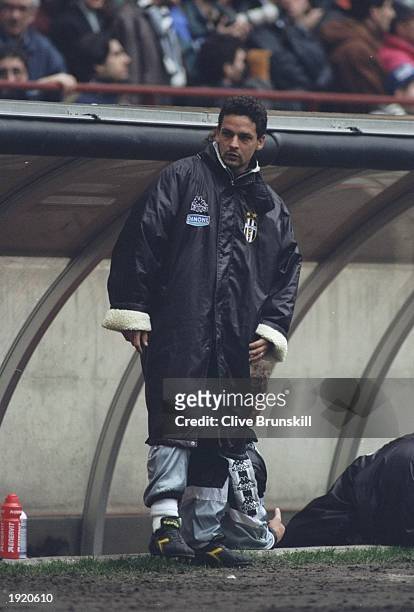 Roberto Baggio of Juventus FC watches from the sidelines during a Serie A match against Inter Milan at the San Siro Stadium in Milan, Italy. The...