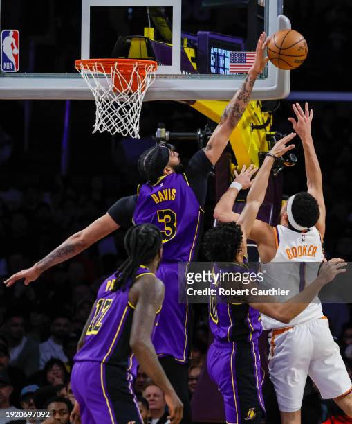 Los Angeles, CA, Thursday, January 11, 2024 - Los Angeles Lakers forward Anthony Davis blocks the shot of Phoenix Suns guard Devin Booker during...