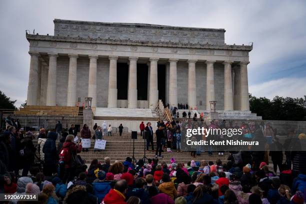 Students from Watkins Elementary School take turns reading Martin Luther King Jr.'s "I Have a Dream" speech at the Lincoln Memorial on January 12,...