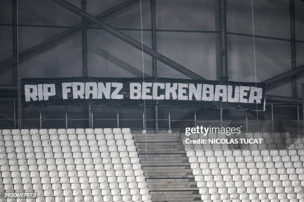 Banner is installed to pay respect to late German football legend Franz Beckenbauer ahead of the French L1 football match between Olympique de...