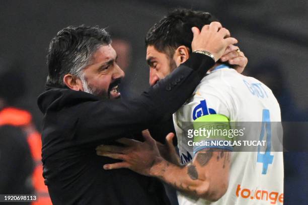Marseille's French defender Samuel Gigot celebrates with Marseillle's Italian head coach Gennaro Gattuso after scoring his team's first goal during...