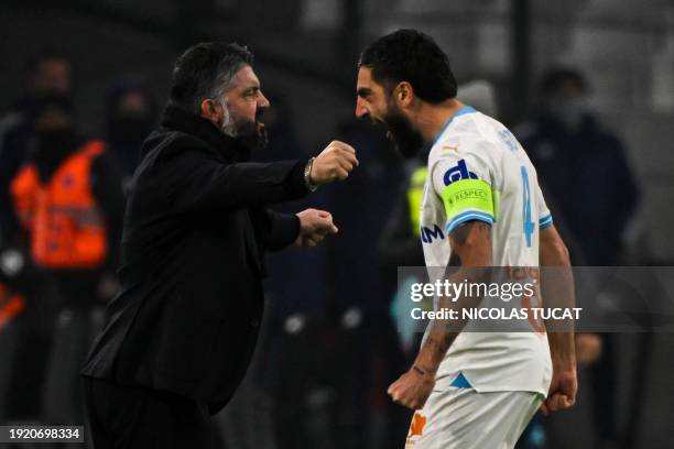 Marseille's French defender Samuel Gigot celebrates with Marseillle's Italian head coach Gennaro Gattuso after scoring his team's first goal during...