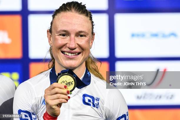 First placed Norway's Anita Yvonne Stenberg celebrates with her gold medal on the podium of the Women's Omnium during the third day of the UEC...