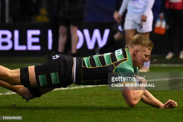 Northampton Saints' English flanker Tom Pearson scores a try during the European Rugby Champions Cup Pool 3 rugby union match between Northampton...