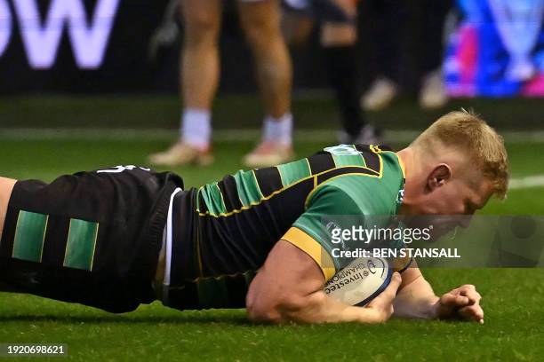 Northampton Saints' English flanker Tom Pearson scores a try during the European Rugby Champions Cup Pool 3 rugby union match between Northampton...