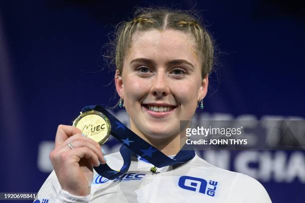 Britain's Emma Finucane celebrates with her gold medal on the podium for the Women's Sprint during the third day of the UEC European Track Cycling...