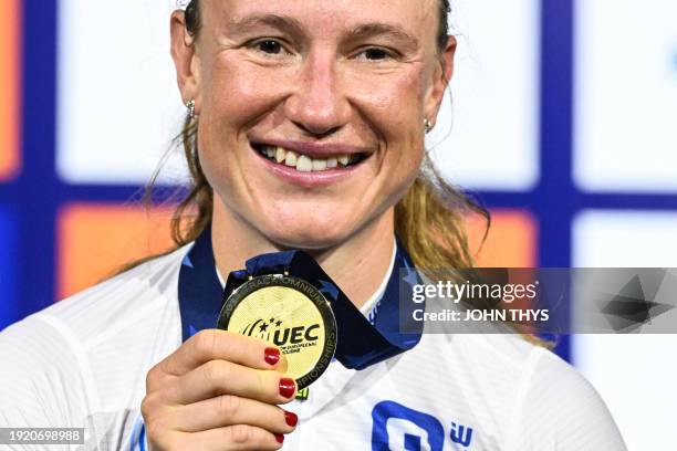 First placed Norway's Anita Yvonne Stenberg celebrates with her gold medal on the podium of the Women's Omnium during the third day of the UEC...