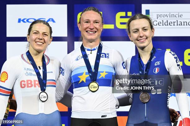 Second placed Britain's Neah Evans , First placed Norway's Anita Yvonne Stenberg and Third placed France's Valentine Fortin celebrate with medals on...