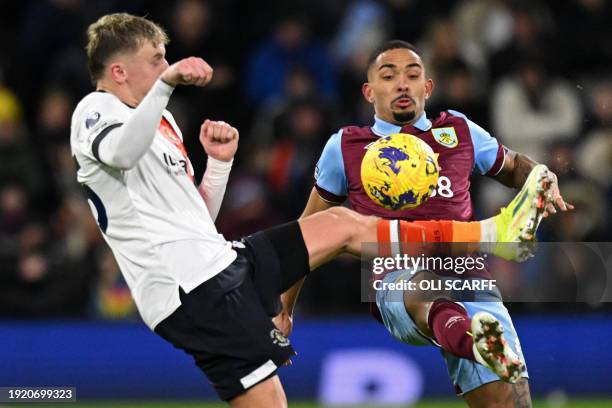 Luton Town's English midfielder Alfie Doughty vies with Burnley's Brazilian defender Vitinho during the English Premier League football match between...