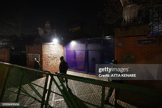Security staff stand guard in front of the British embassy during a demonstration in solidarity with the Palestinian people and Iran-backed Yemeni...