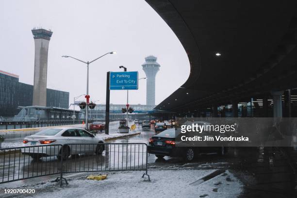 Travellers are dropped off and picked up outside of the terminals at O'Hare Airport on January 12, 2024 in Chicago, Illinois. Over 1,900 flights have...