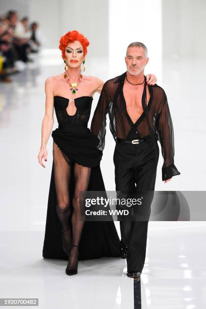 Model and Dan Caten on the runway at Dsquared2 Men's Fall 2024 as part of Milan Men's Fashion Week held on January 12, 2024 in Milan, Italy.