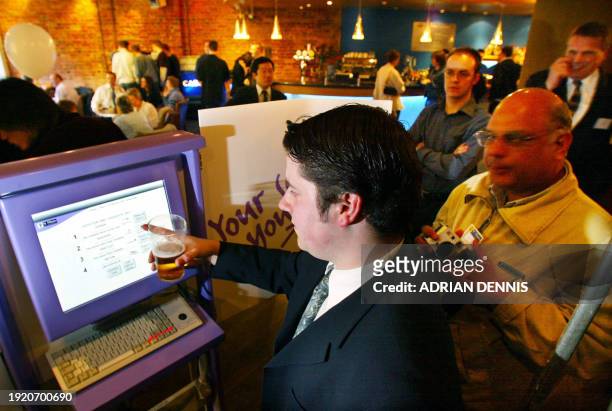 People in Bar Casa practice sending their local authority election vote during the launch of e-voting in St Albans 19 April 2002. St Albans Council...