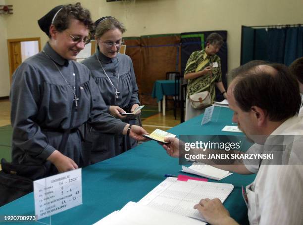 Two nuns from the Urszulanki convent, the place from which Karol Wojtyla left for the conclave to Rome to become Pope, are checking their names on...