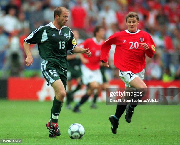 June 21: Mladen Rudonja of Slovenia and Ole Gunnar Solskjaer of Norway challenge during the UEFA Euro 2000 Group C match between Slovenia and Norway...