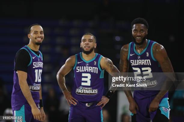 Amari Bailey, Terrell Brown Jr. #3 and Jeremiah Tilmon of the Greensboro Swarm look on during the game against the Capital City Go-Go on January 12,...