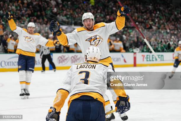 Jeremy Lauzon of the Nashville Predators celebrate a goal with team against the Dallas Stars at the American Airlines Center on January 12, 2024 in...