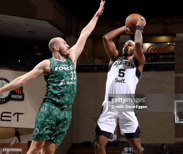 January 12: Justin Kier of the Austin Spurs shoots the ball against Jon Elmore of the Sioux Falls Skyforce during their game at the Sanford Pentagon...